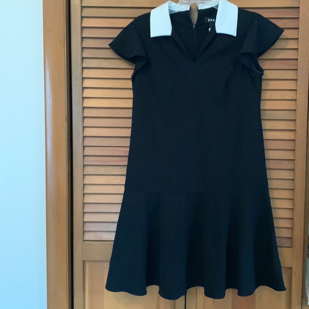 DKNY size 6, black with white collar. Zip back. Cap sleeves. Worn twice.